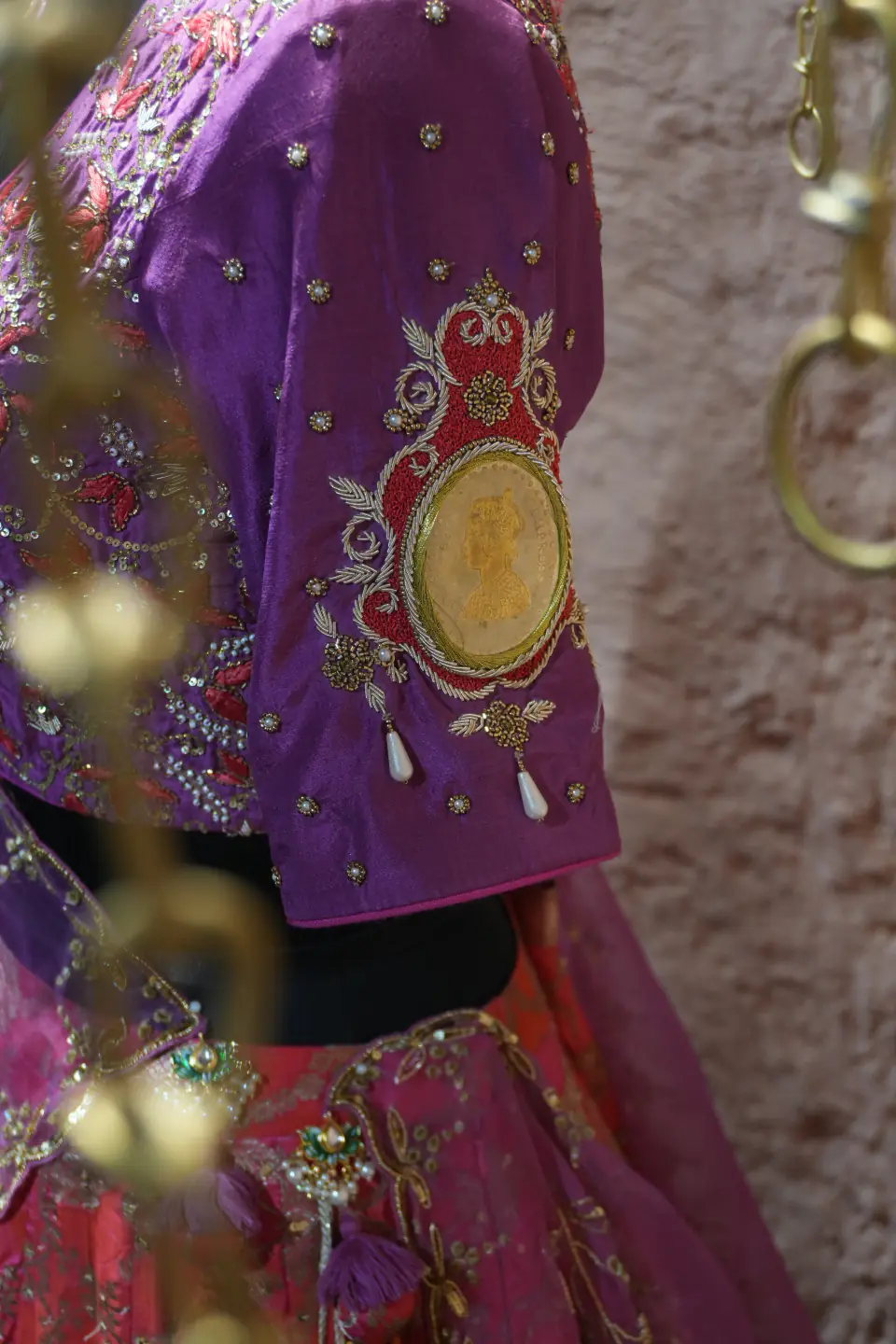 Orchid and Coral Lehenga by Yukti Vohra — embroidered sleeve, close up