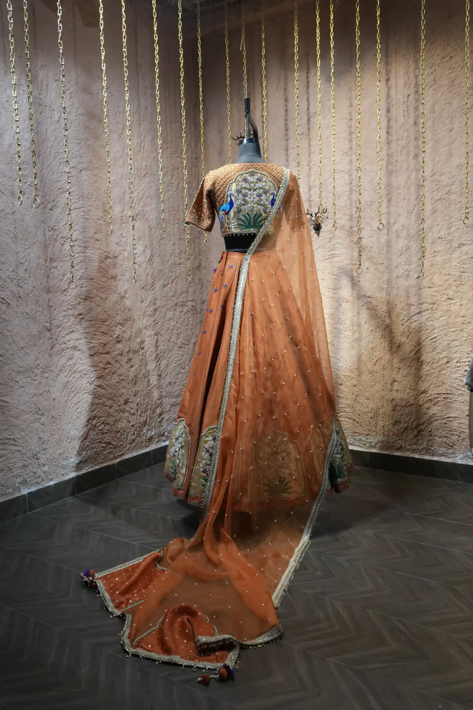 Rust Silk Lehenga with Mughal Arch Panels by Yukti Vohra — with trailing dupatta