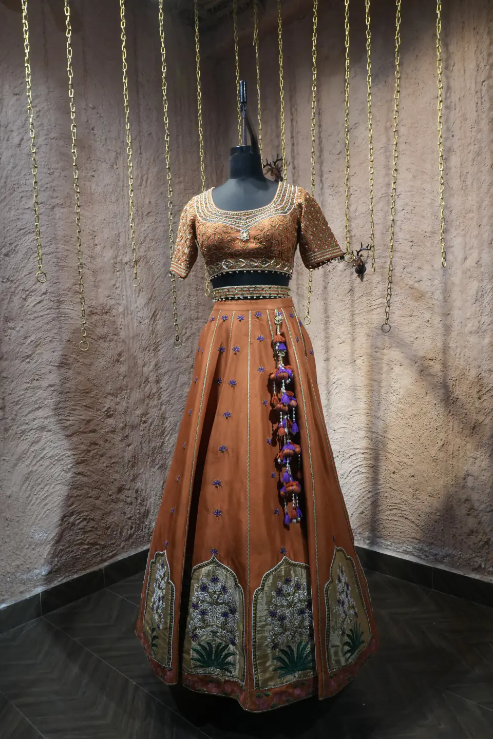 Rust Silk Lehenga with Mughal Arch Panels by Yukti Vohra — side view