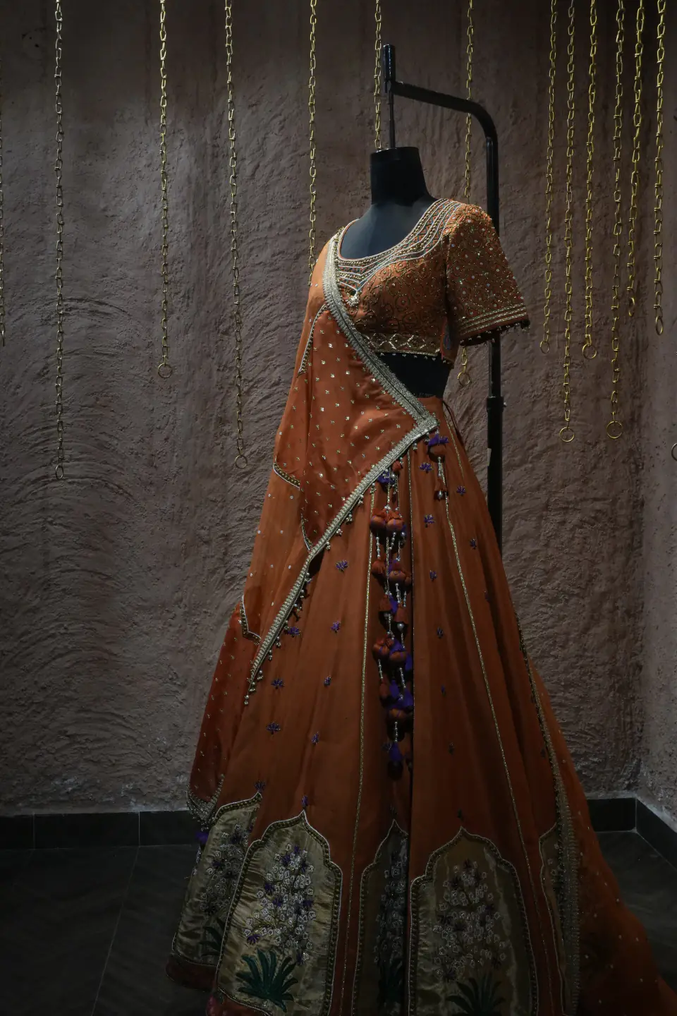 Rust Silk Lehenga with Mughal Arch Panels by Yukti Vohra — draped dupatta, side